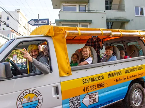 Open-air van on the Alcatraz city tour driving past San Francisco landmarks